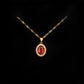 Elegant copper gold necklace with oval bejeweled pendant - ruby red